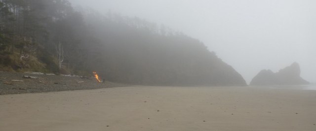 A distant bonfire on the beach
